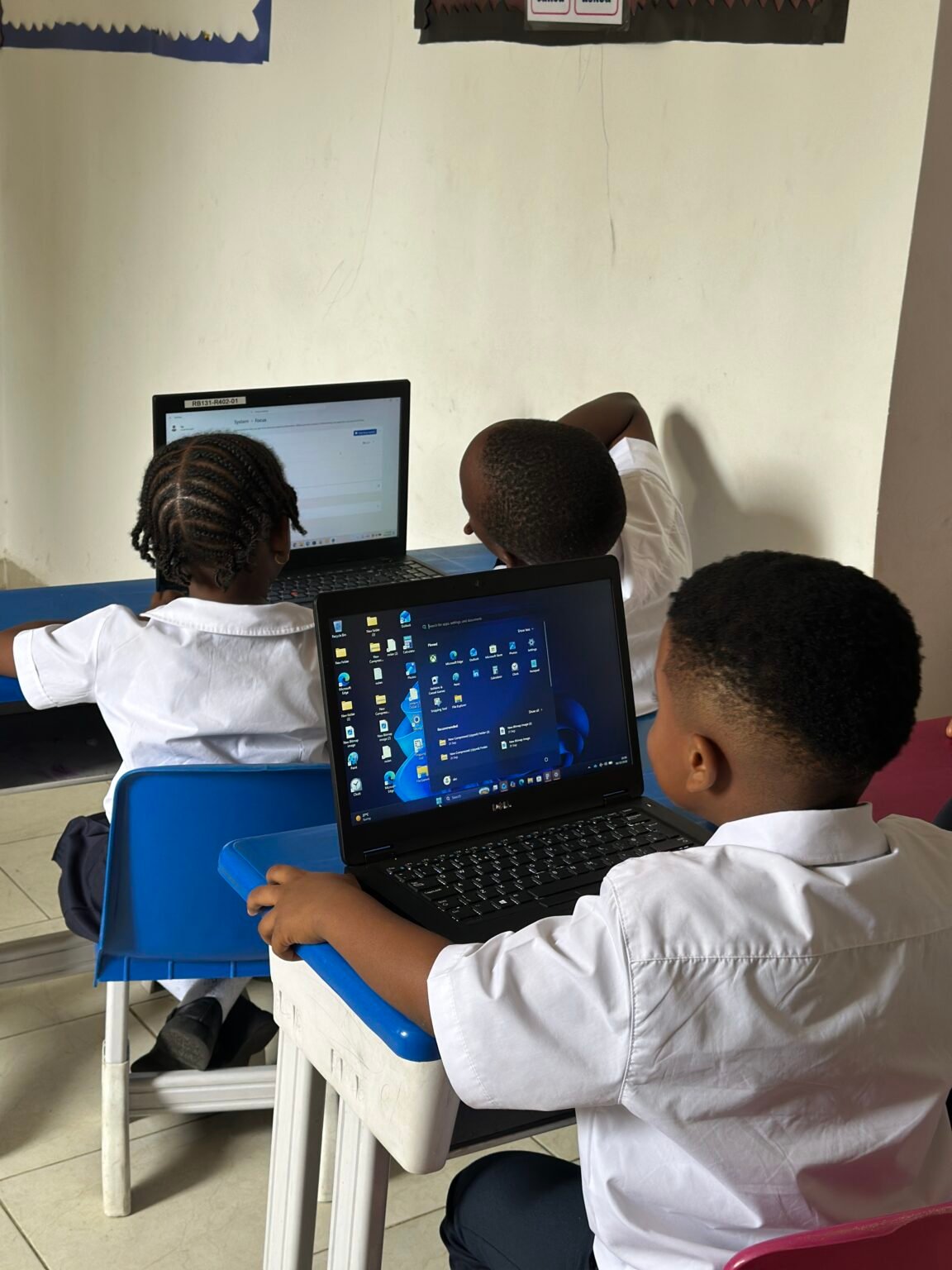 Pupils working on laptops during a computer lesson